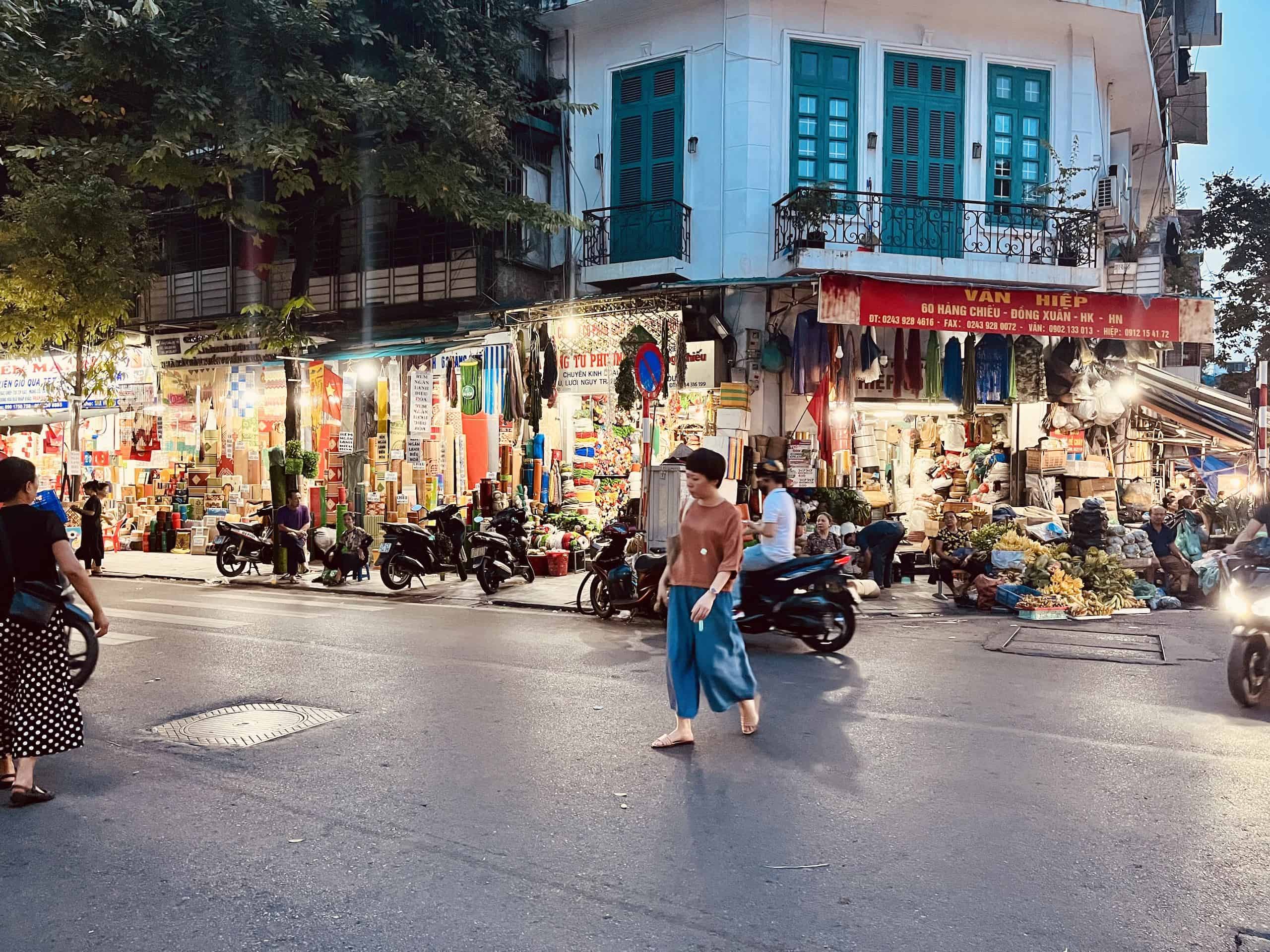 The streets in Hanoi's Old Quarter are beautifully illuminated and bustling in the evening