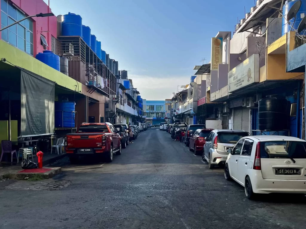 Visiting Semporna: What to Know Before You Dive or Transit 3 The city center of Semporna, simple houses lining a street